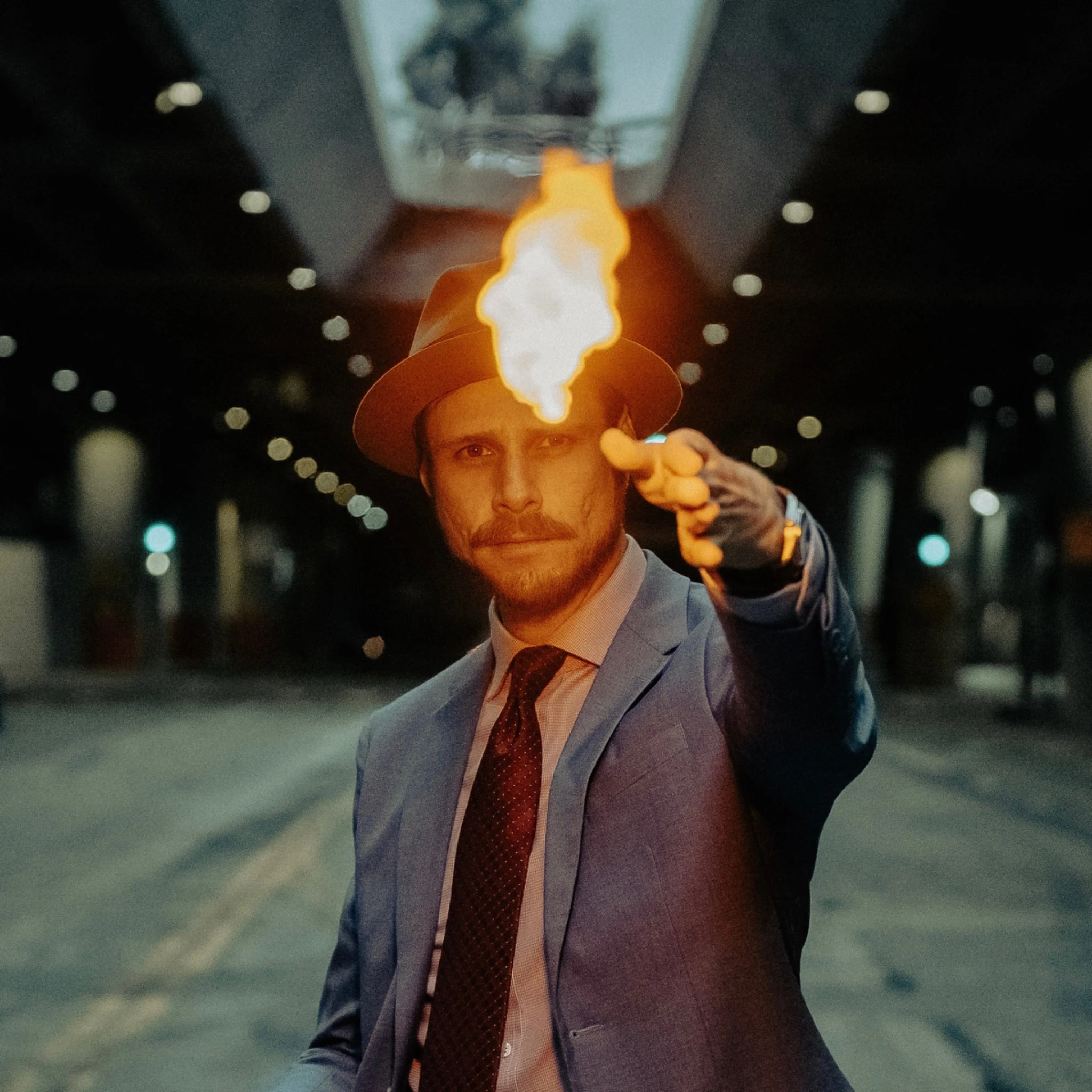 Cinematic portrait of Jeff Thomson performing fire magic